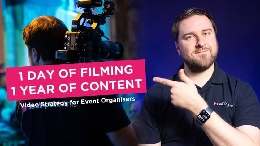 A person in a black polo shirt points toward text that reads "1 DAY OF FILMING 1 YEAR OF CONTENT," while a videographer in the background operates a professional camera on their shoulder. The image includes the secondary text "Video Strategy for Event Organisers" against a split blue and dark background.
